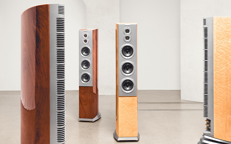 Four Audiovector R10 speakers. Two facing front and two facing to the side. they're in a well lit open space