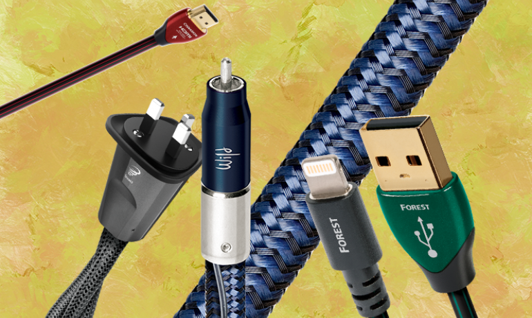 Various Audioquest cables on a yellow, splodgy background