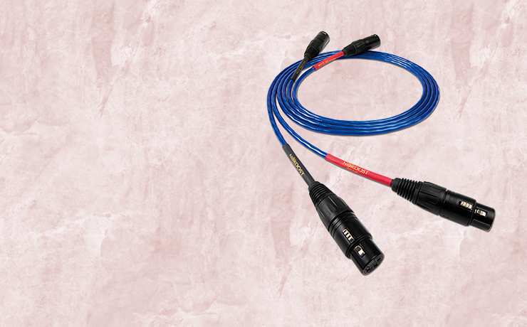 Nordost Blue Heaven Analogue Interconnect.  Background is a salmon marble pattern.