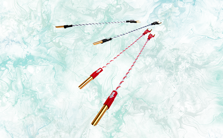 Nordost Norse 2 Bi-Wire Jumpers on a faint, green liquid ink background