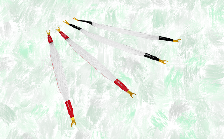 Nordost Valhalla 2 Bi-Wire Jumpers on a faded green and grey splodgy background.