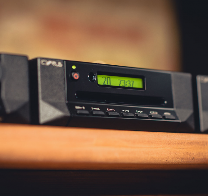Cyrus CD T CD Transport on a wooden shelf.