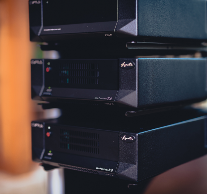 Cyrus Mono X 300 mono power amplifier with two other pieces of Cyrus equipment.