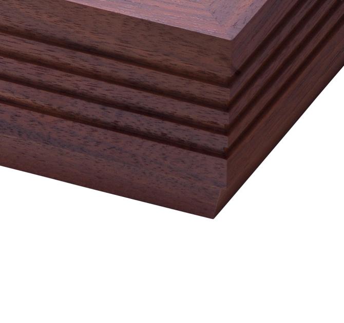 the corner of a rosenut fluted plinth