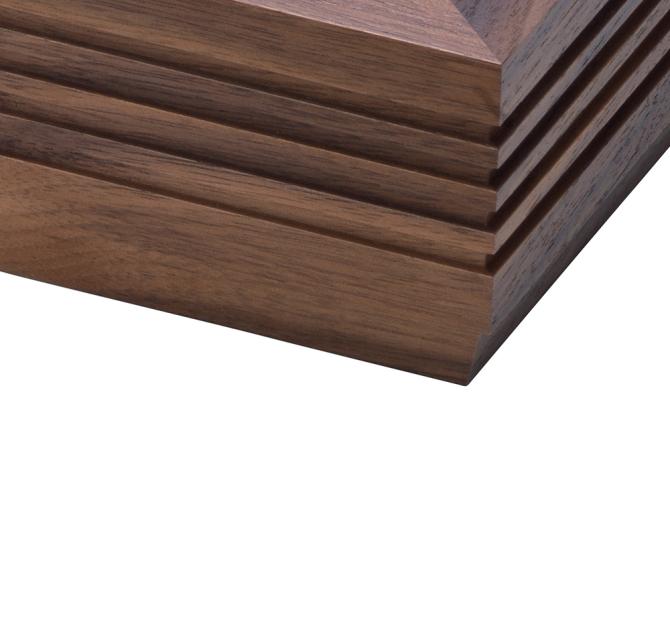 The corner of a walnut fluted Linn LP12 turntable plinth