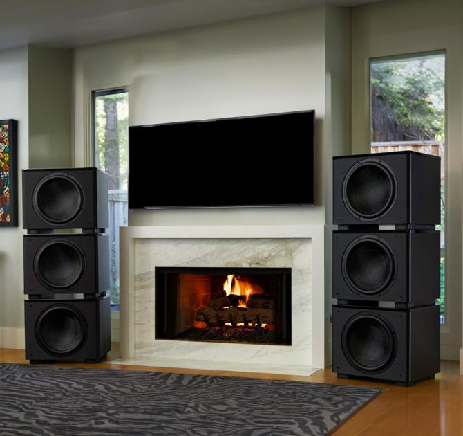 REL HT/1510 Predator Subwoofer - two stacks of three either side of a tv
