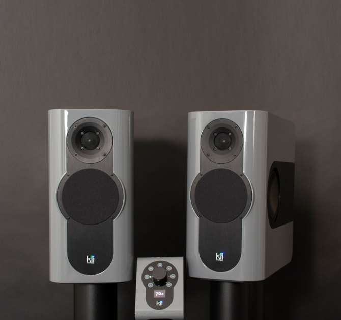 A pair of Kii Three Loudspeakers in Nardo Grey High Gloss with a matching Kii Controller