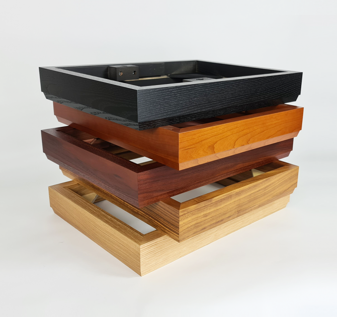 LP12 plinths stacked.  In order from the top: black ash; cherry; rosenut; walnut; and oak
