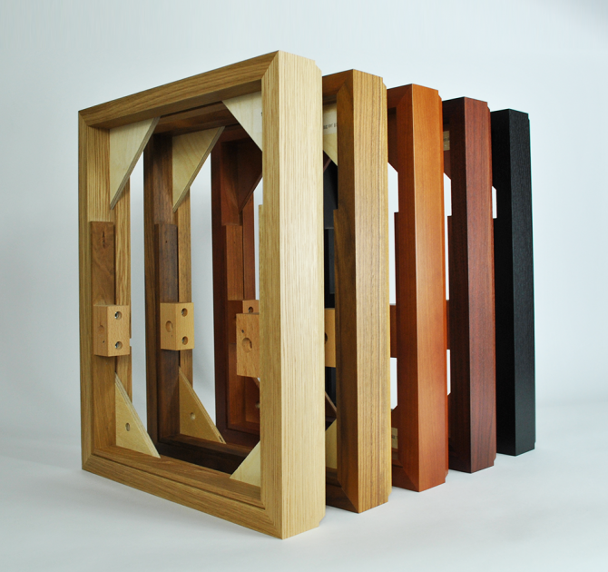 all five plinth options standing up on their end, one in front of the other.  Order from front to back is oak, walnut, cherry, rosenut and black ash