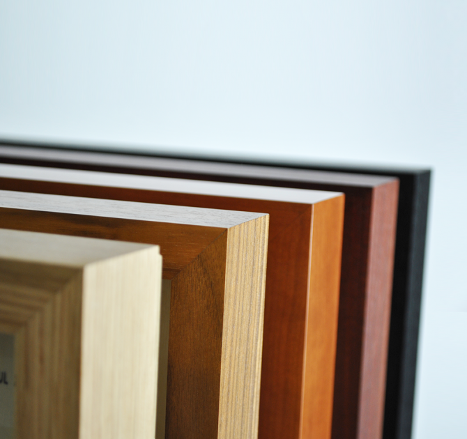 all five plinth options standing up on their end, one in front of the other.  Order from front to back is oak, walnut, cherry, rosenut and black ash