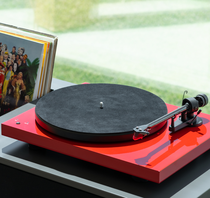 Project Leather-IT 12" leather mat in dark grey on top of a red turntable