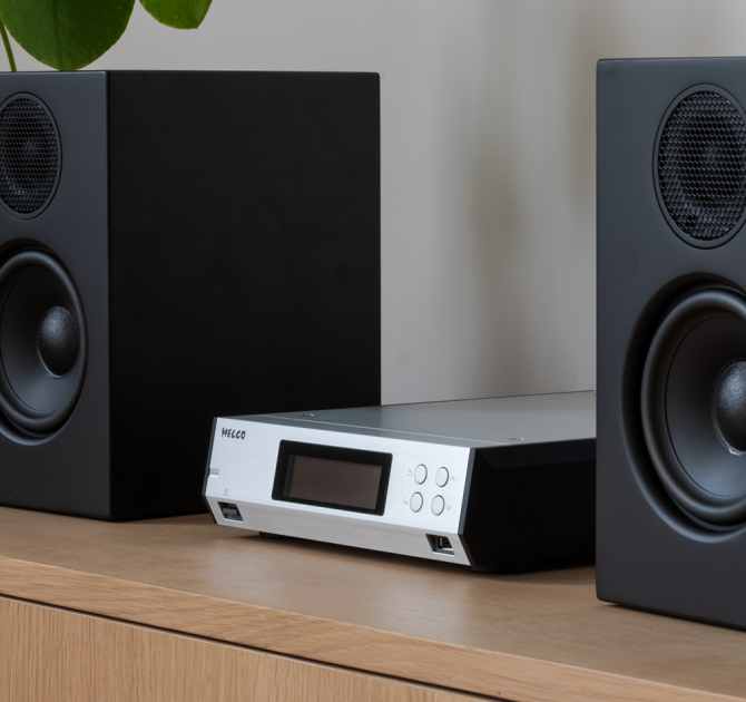 Melco N100 - HiRes Music Library - 2TB HDD, Silver between two speakers