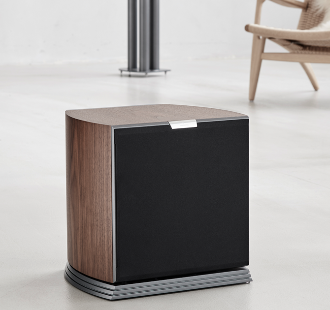 Audiovector R Sub in italian walnut grille on with a chair in the background