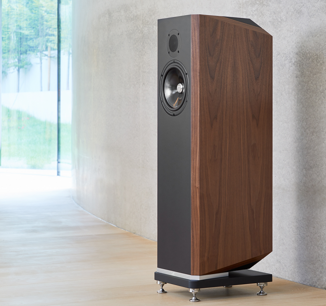 A single Kudos Titan 707 speaker with the grill off in front of a polished concrete wall.