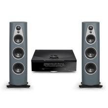 an image of two large floor standing speakers in light blue either side of a Linn Klimax DSM which is in black.  It has a front display and a dial on the top.