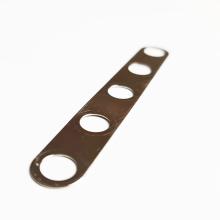 Linn 5-way Speaker Link Plate (20mm pitch).  A strip of gold coloured metal with five evenly spaced holes.