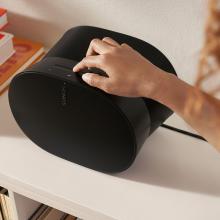 SONOS Era 300 Loudspeaker with a person's hand touching the controls