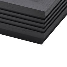 The corner of a fluted black ash plinth