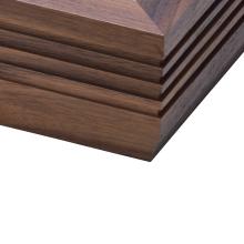 The corner of a fluted walnut plinth