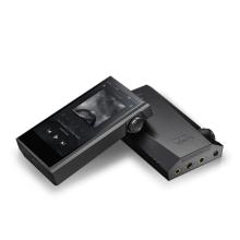 A pair of Astell & Kern Kann Max Portable Music Players.  One laying face down and the other laying face up and resting on the other.