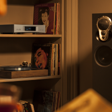 Linn Akurate DSM in a living room on a shelf above an LP12.