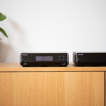 Melco N10/2 Digital Music Library in black.  One beside the other on a sideboard.