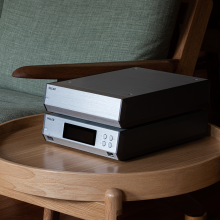 Melco N10/2 Digital Music Library in silver, one on top of the other on a table.