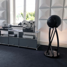 Cabasse Pearl Pelegrina Loudspeaker in black in a living area.
