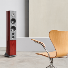 Audiovector R6 Signature in front of a wooden chair