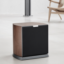 Audiovector R Sub in italian walnut grille on with a chair in the background