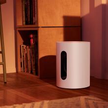 SONOS Sub Mini on the floor in the corner of a living room