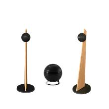 Cabasse iO3 speakers in black with oak stands with a pearl sub